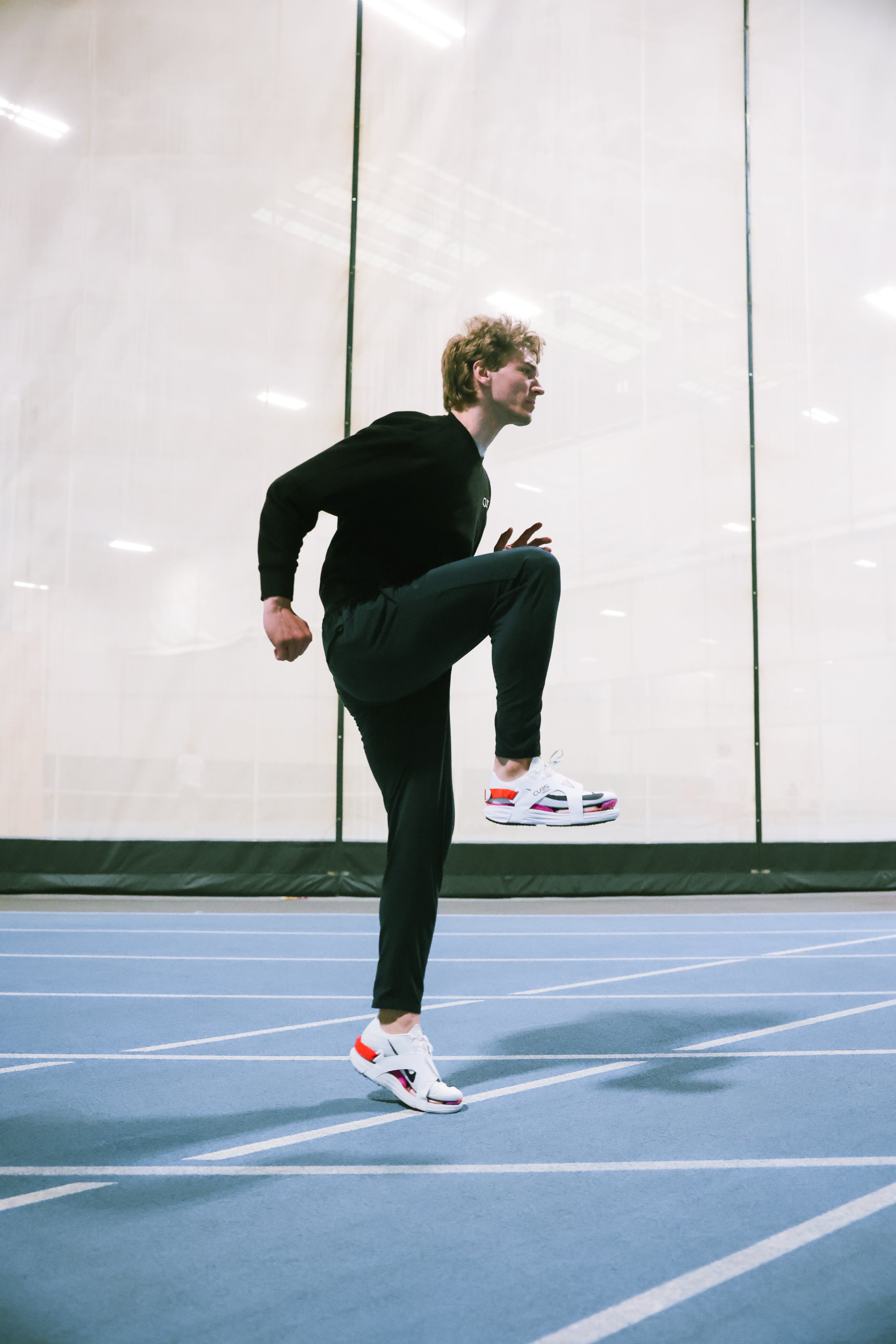 Covers for track spikes — secure heel strap design